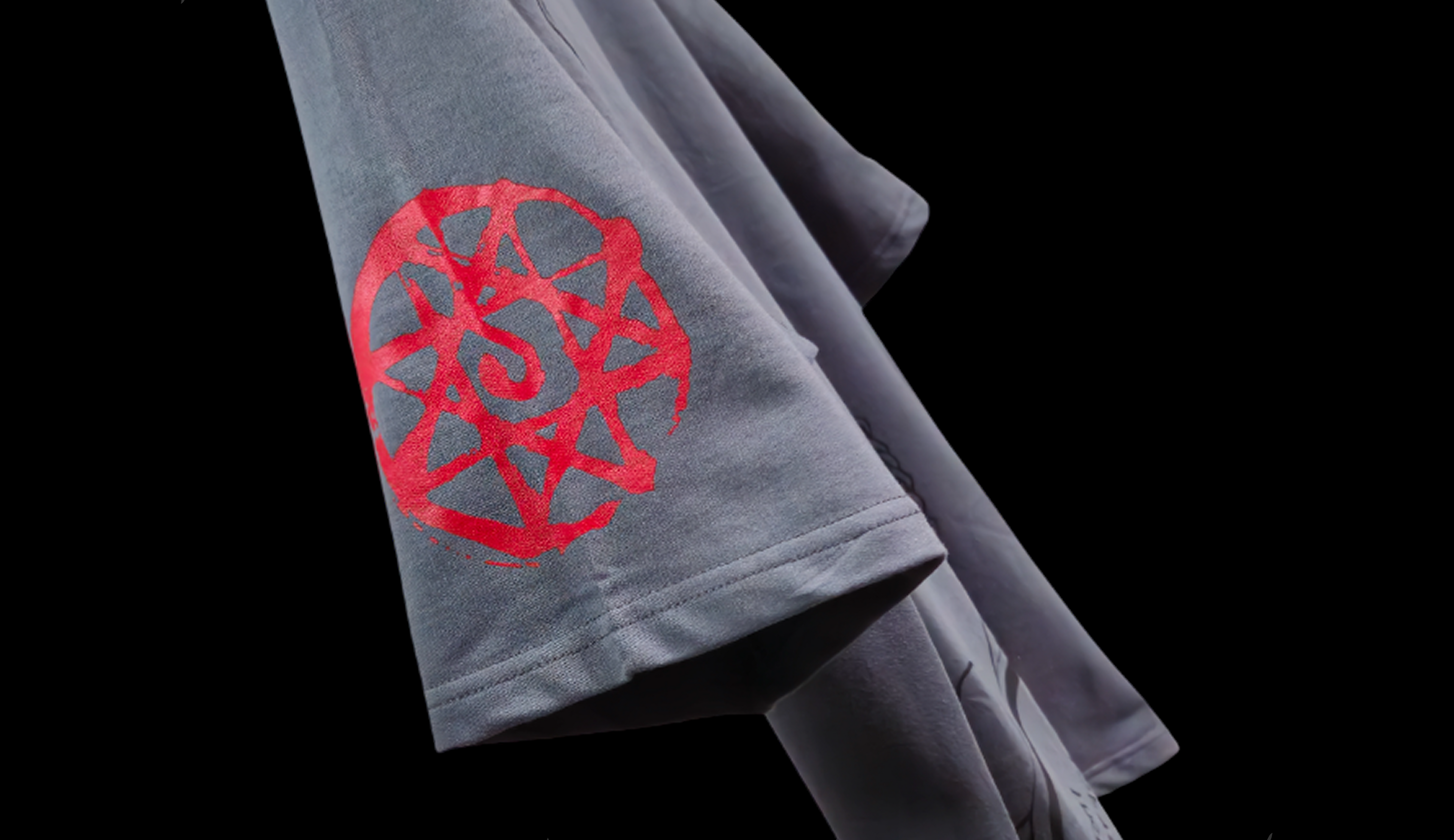 Gray t-shirt with red logo on a black background with 'Philosopher's Stone' text.
